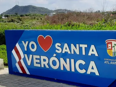 a blue sign for a santinia verona sign at KAZA Balcones in Santa Veronica