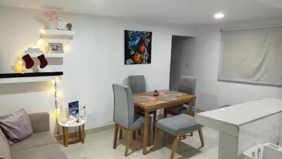 a dining room table and chairs in a room at Hermoso y cómodo apartamento in Cartagena de Indias