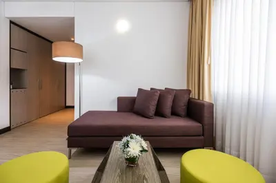 a living room with a couch and a table at Holiday Inn Express - Cartagena Bocagrande by IHG in Cartagena de Indias