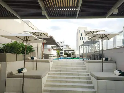 a group of stairs with umbrellas in a building at Holiday Inn Express - Cartagena Bocagrande by IHG in Cartagena de Indias