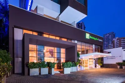a large building with plants in front of it at Holiday Inn Express - Cartagena Bocagrande by IHG in Cartagena de Indias