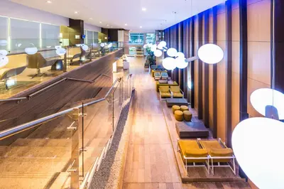 a waiting area in a hospital with chairs and tables at Holiday Inn Express - Cartagena Bocagrande by IHG in Cartagena de Indias