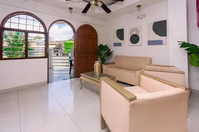 a living room with a couch and a table at Hotel Med Cartagena in Cartagena de Indias