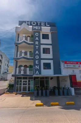 a hotel with a sign on the side of a building at Hotel Med Cartagena in Cartagena de Indias