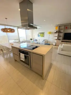 a kitchen with a stove top oven in a room at Apartamento frente al Mar Cartagena in Cartagena de Indias