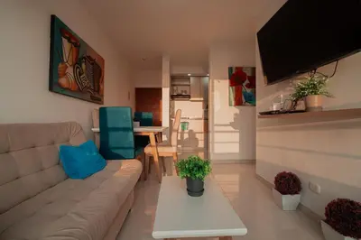 a living room with a couch and a table at Apartamento El Colibri CARTAGENA en TORRE PRIMI in Cartagena de Indias