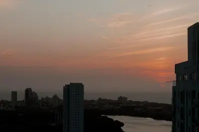 a view of a city with a sunset in the sky at Apartamento El Colibri CARTAGENA en TORRE PRIMI in Cartagena de Indias