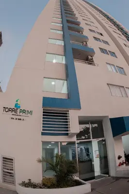 a tall building with a sign on the side of it at Apartamento El Colibri CARTAGENA en TORRE PRIMI in Cartagena de Indias