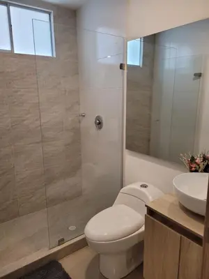a bathroom with a shower and a toilet and a sink at Apartamento cerca al Mar in Cartagena de Indias