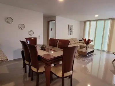 a dining room with a table and chairs at Apartamento cerca al Mar in Cartagena de Indias