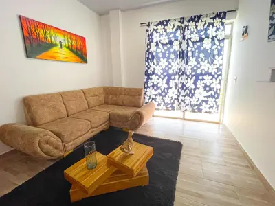 a living room with a couch and a table at Apartamento Doña Flor in Coveñas