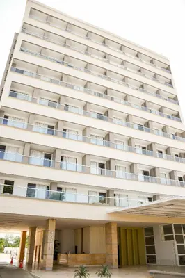 an external view of a large white building at Ciela Hotel in Coveñas
