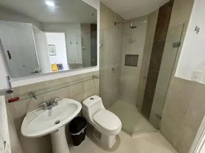 a bathroom with a toilet and a sink and a shower at Apartamento en Edificio Portofino 606 ICDI in Cartagena de Indias