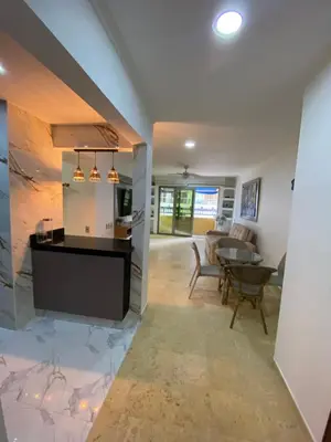 a kitchen and living room with a table and chairs at YOLO solo se vive una vez - MORROS Cartagena in Cartagena de Indias