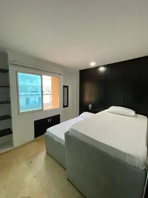 a bedroom with a large bed and a window at YOLO solo se vive una vez - MORROS Cartagena in Cartagena de Indias