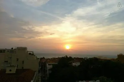 a view of the sunset from a city at Apartamento en Cartagena, cerca al mar, edificio Nuevo Conquistador in Cartagena de Indias