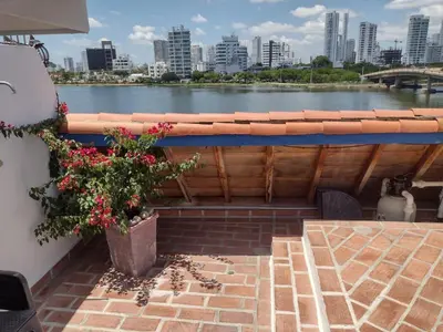 a balcony with a view of a river and a city at Casa Marqués del Pedregal in Cartagena de Indias