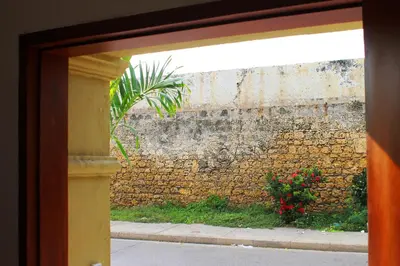 a view of a brick wall with a window at Casa Marqués del Pedregal in Cartagena de Indias