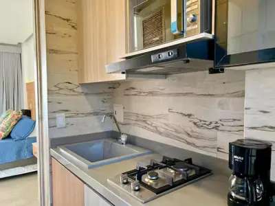 a kitchen with a sink and a stove top oven at Casa Luna Laguna Beach in Tolú