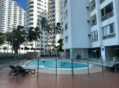 a swimming pool in the middle of a building at Amazing Ocean View apartment with Pool in Laguito Cartagena in Cartagena de Indias