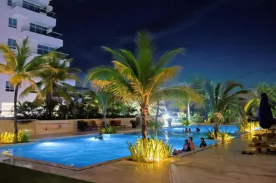 a pool at the resort at night at Apartamento Cartagena Morros Epic con acceso directo a la playa in Cartagena de Indias