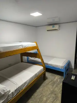 a room with two bunk beds in a room at Hotel Palmetto Beach Coveñas in Coveñas