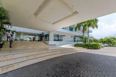 a person standing in front of a building at Apartamento de lujo en Cartagena Seaway935 - Morros in Cartagena de Indias