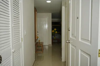 a hallway with a door leading to a room at Frente al mar, Boca grande APT1105 in Cartagena de Indias