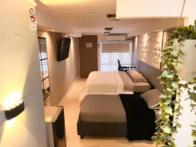 a bedroom with a large bed in a room at ¡La mejor Suite! Lujo, ubicación, precio in Barranquilla