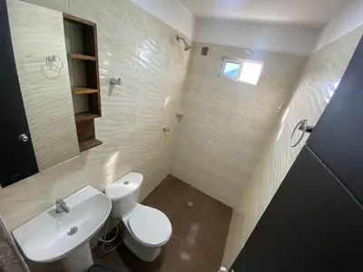 a bathroom with a white toilet and a sink at lindo Apartamento completo in Cartagena de Indias