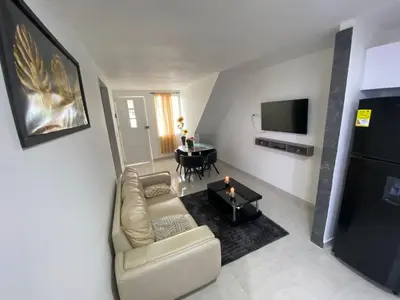 a living room with a couch and a table at lindo Apartamento completo in Cartagena de Indias