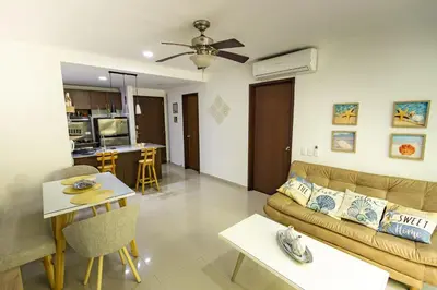 a living room with a couch and a table at Paraíso Costero Morros Vitri La Boquilla familiar 4 personas in Cartagena de Indias