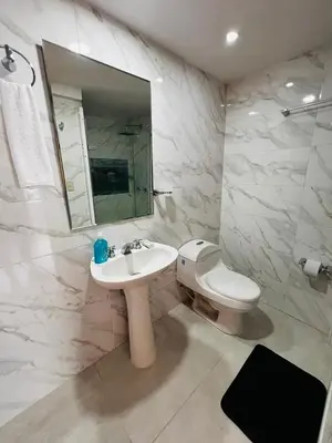 a bathroom with a sink and a toilet and a mirror at APTO 802 VISTA AL MAR in Cartagena de Indias