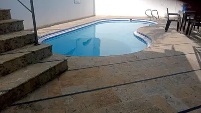 a swimming pool with stairs next to a building at APTO 802 VISTA AL MAR in Cartagena de Indias