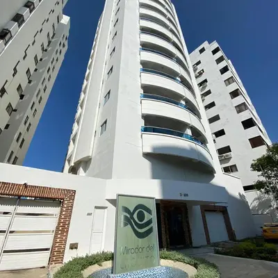 a tall white building with a sign in front of it at suite incanto con vista al lago in Cartagena de Indias