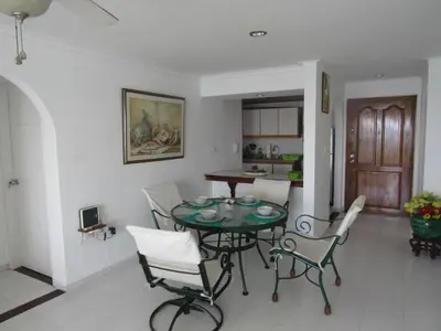 a dining room and kitchen with a table and chairs at Magia frente al Mar Caribe in Cartagena de Indias