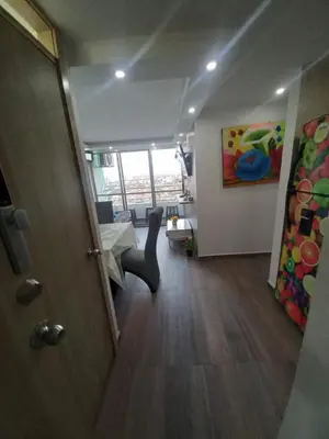 a hallway of a room with a table and a chair at AQUALINASTAR in Cartagena de Indias