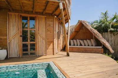 a resort with a swimming pool and a house at JERUSALEMA BEACH GLAMPING in Tolú