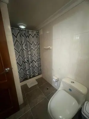 a bathroom with a toilet and a shower at A un paso del mar in Cartagena de Indias