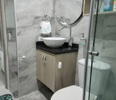 a bathroom with a sink and a toilet and a shower at Apartamento cerca al Mar, en Cartagena COL in Cartagena de Indias