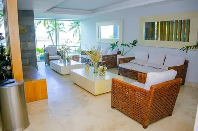 a living room with a couch and a table at Apartament Bocagrande Palmetto Beach Front 3204 in Cartagena de Indias