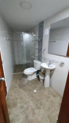 a bathroom with a toilet and a sink at Confort en la zona del Laguito in Cartagena de Indias