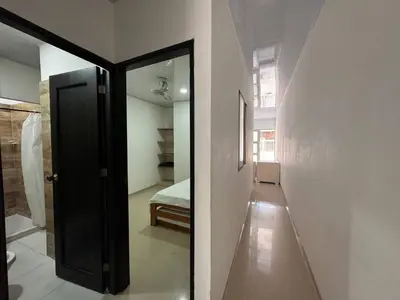 a hallway with a door leading to a bedroom at Summer - Apartamento Sector La Coquerita in Coveñas