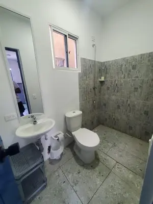 a bathroom with a toilet and a sink at Hotelito La Aventura, AC private WC rooms near the old town, no tax in Cartagena de Indias