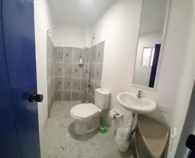 a bathroom with a toilet and a sink at Hotelito La Aventura, AC private WC rooms near the old town, no tax in Cartagena de Indias