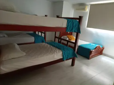 two bunk beds in a room with a window at Hotel Doral Barranquilla in Barranquilla