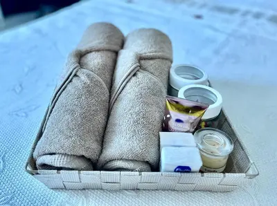a box with towels and cosmetics on a table at Northwest Hostings 201 in Cartagena de Indias