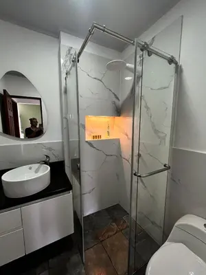 a bathroom with a glass shower and a sink at Northwest Hostings 201 in Cartagena de Indias