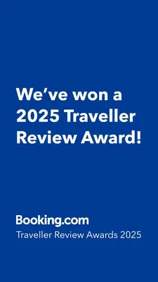a blue sign that says weve won a traveler review award at Northwest Hostings 201 in Cartagena de Indias