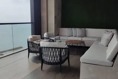 a living room with a couch and chairs and a table at Apartamento nuevo en cartagena en el cabrero in Cartagena de Indias